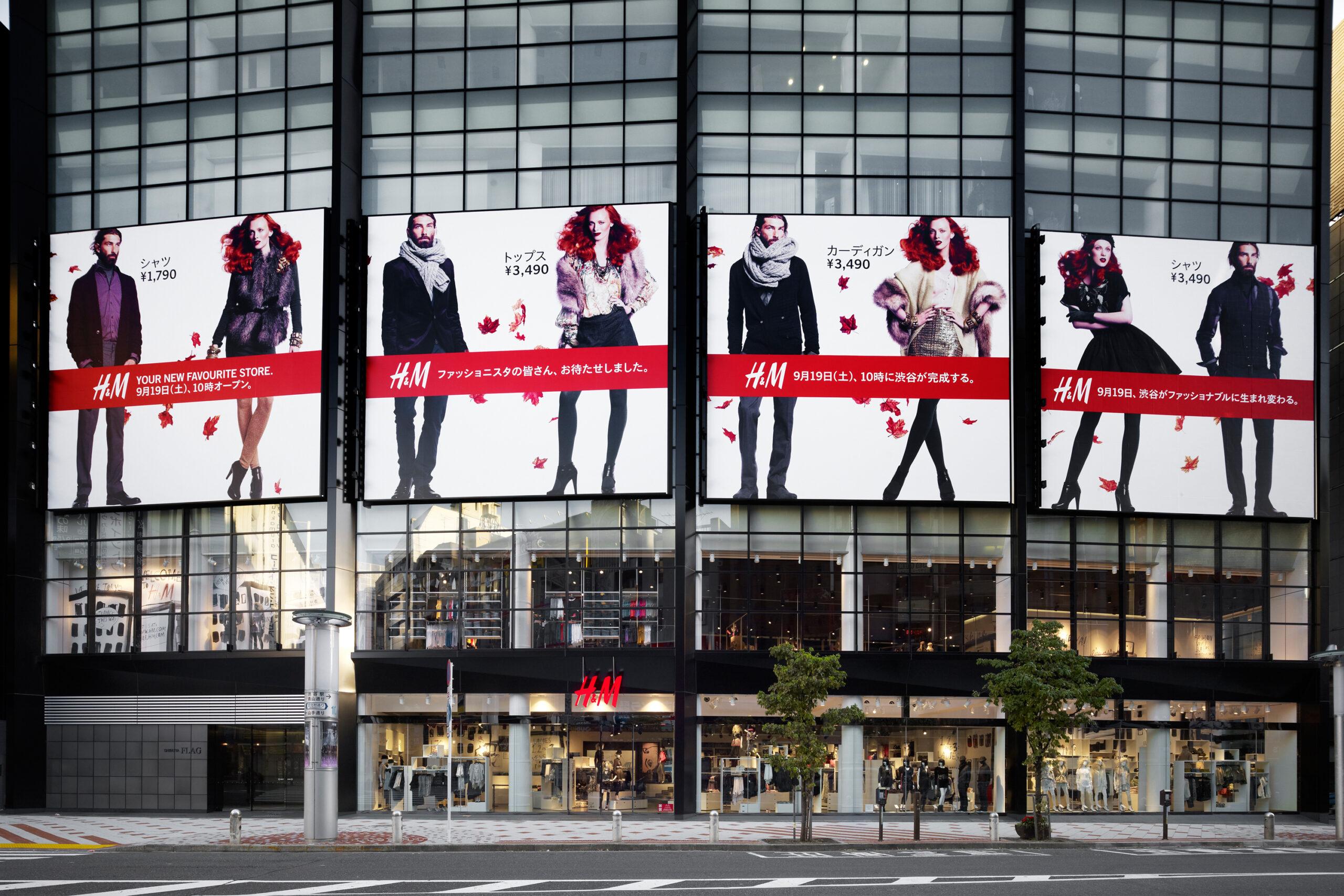 A H&amp;M shop front with big posters.