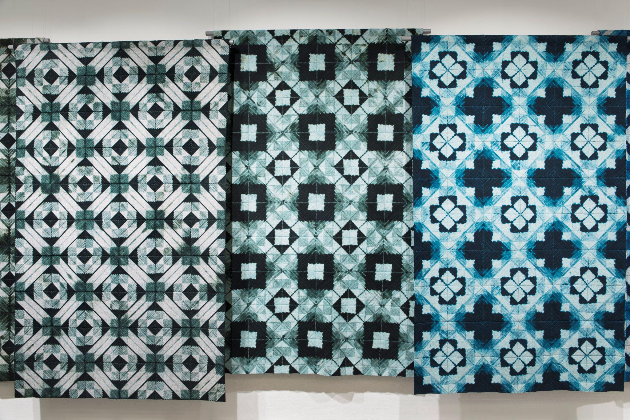 The textile designs with different patterns in nuances of blue.