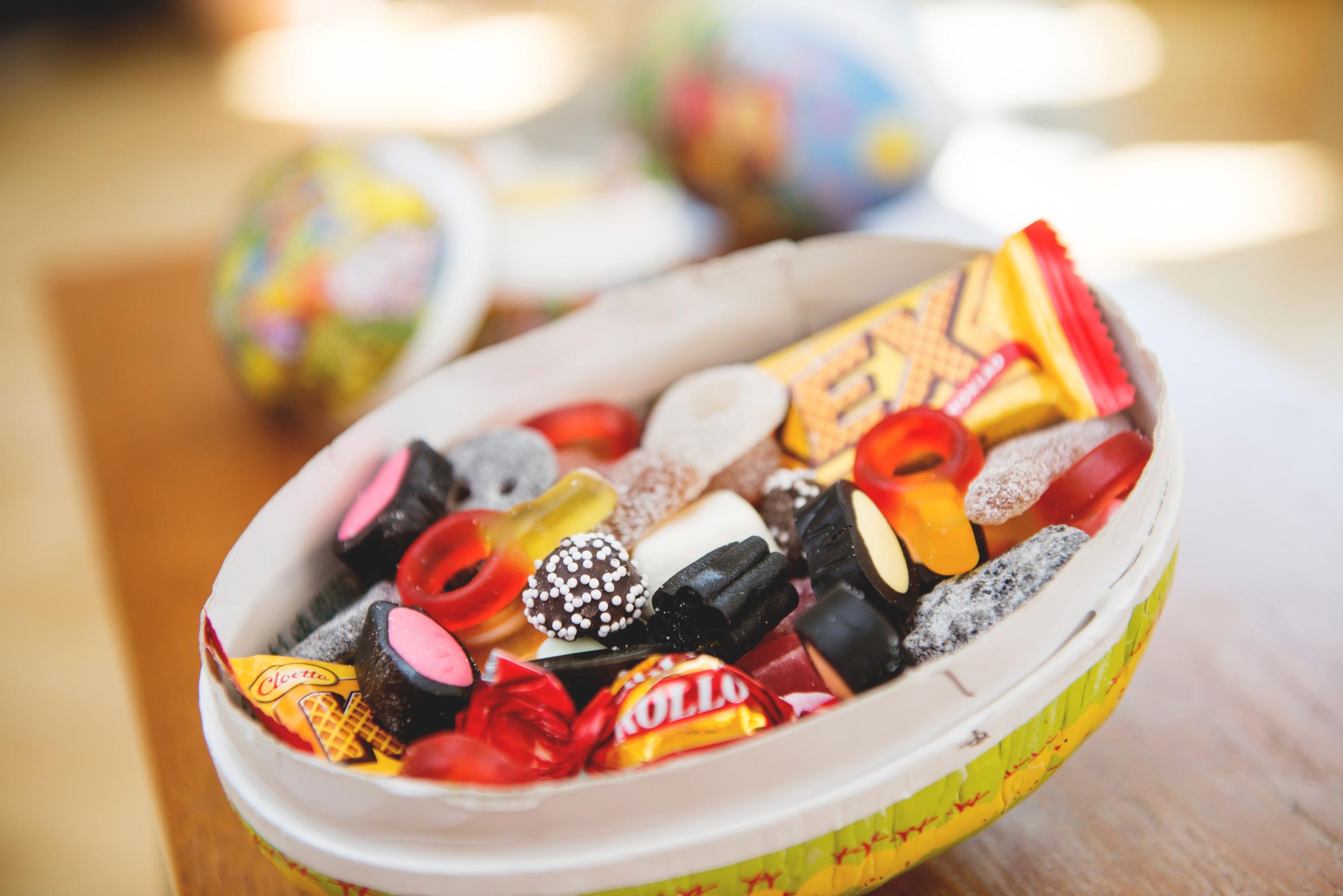 Easter candy eggs An egg-shaped paper bowl filled with candy.