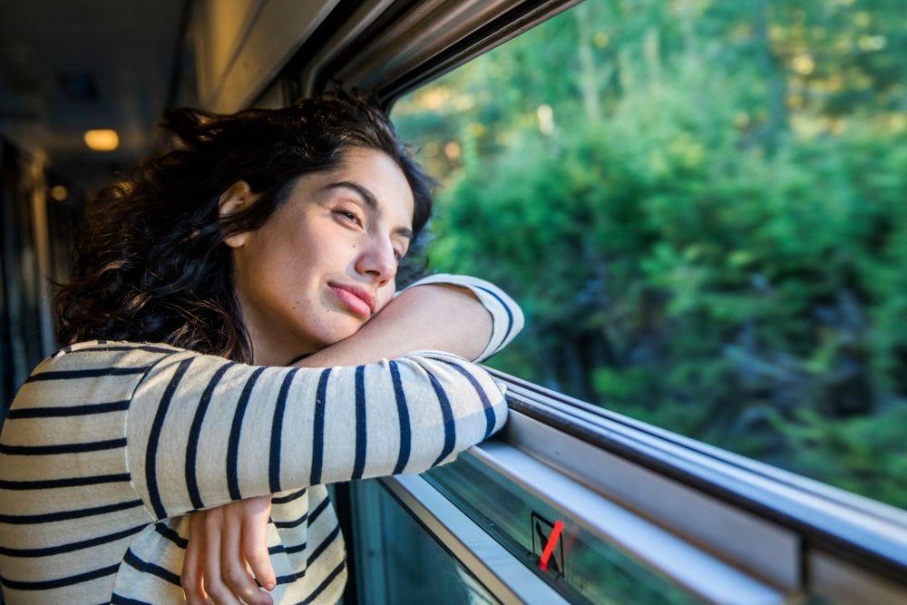 Women looking out the window from a moving train